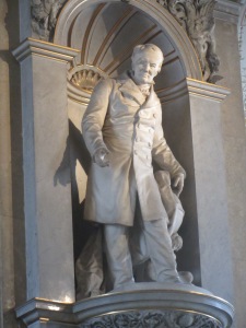 A statue of Alexander von Humboldt in the grand stairwell of the Natural History Museum in Vienna.