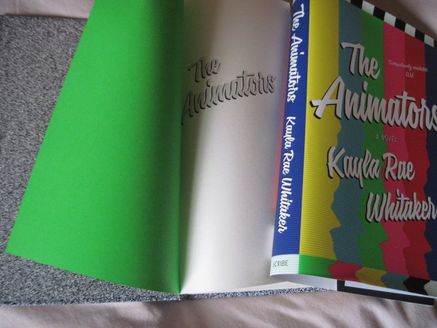 I love the detail that's gone into the book design, especially the black-and-white TV fuzz of the covers under the dust jacket and the pop of neon green on the inside of the endpapers.